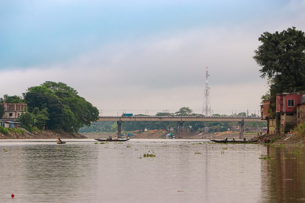 a bridge over a body of water with boats in it