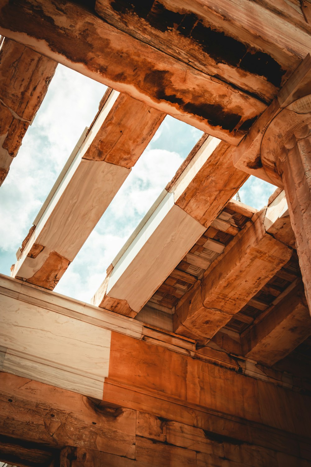 a wooden structure with a skylight in the middle of it