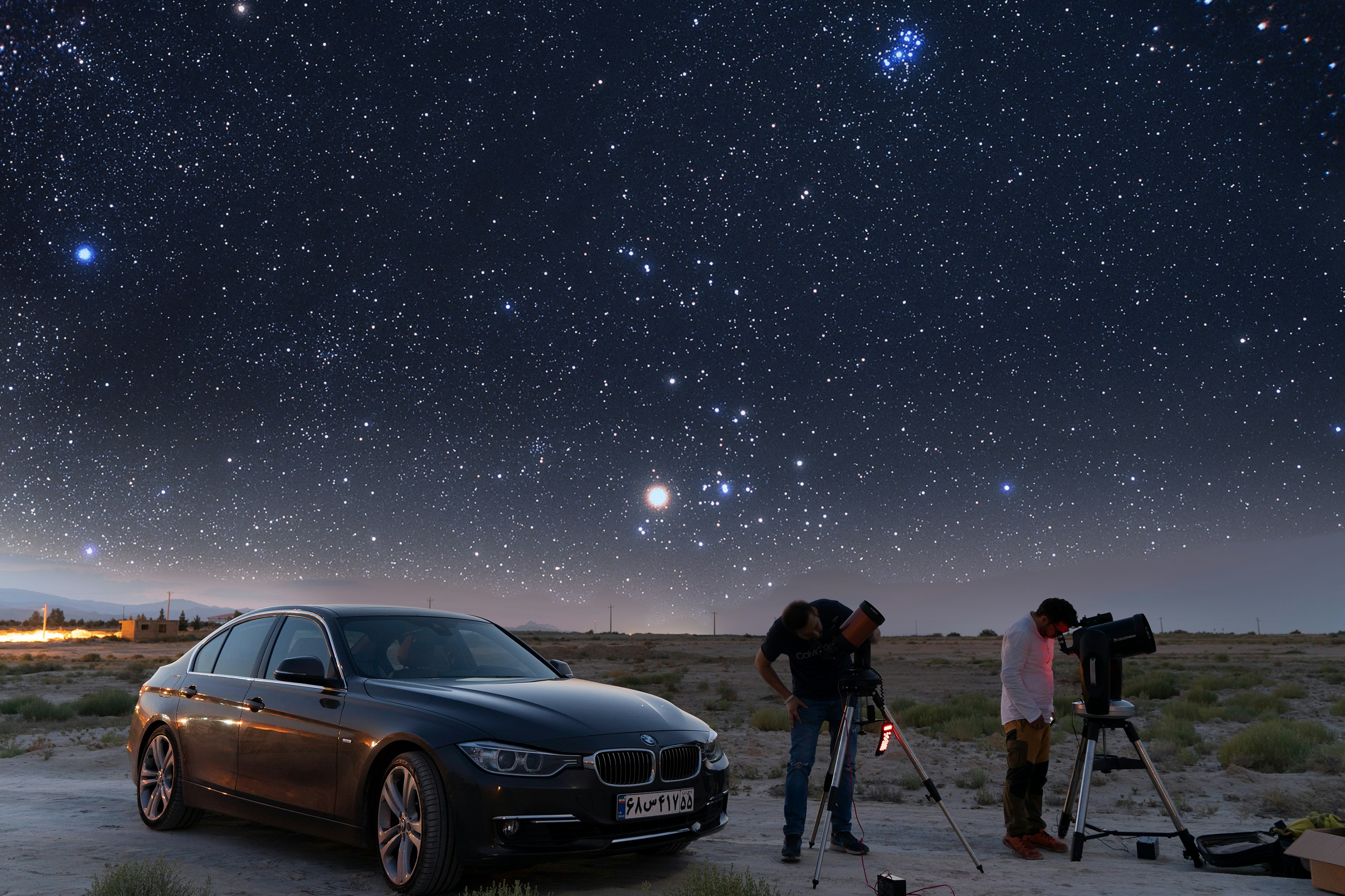 A couple standing beside a parked car