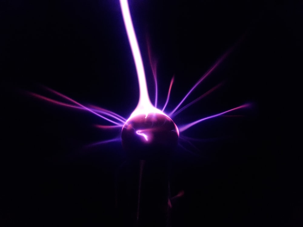 a purple object is glowing in the dark