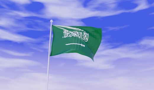 Flags of Saudi Arabia, Japan, and Malaysia symbolizing international work opportunities.