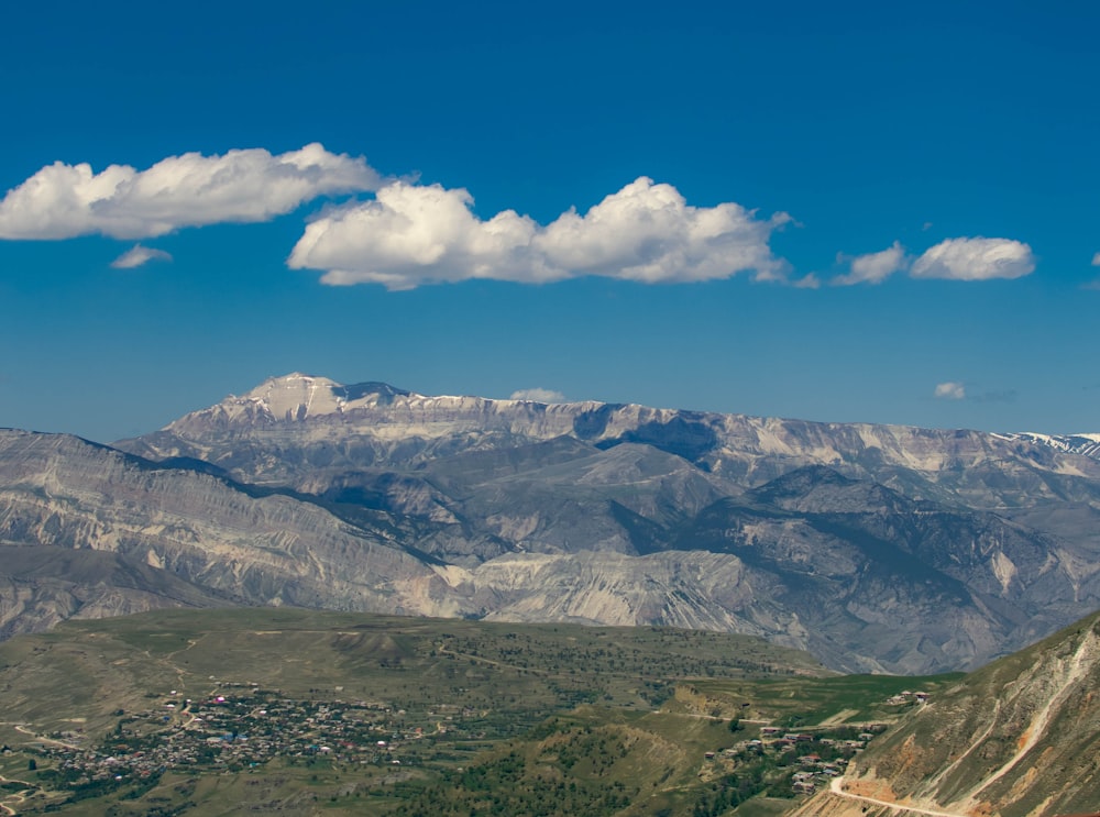 a view of a mountain range with a town below