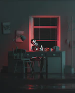 a dark room with a desk and a chair
