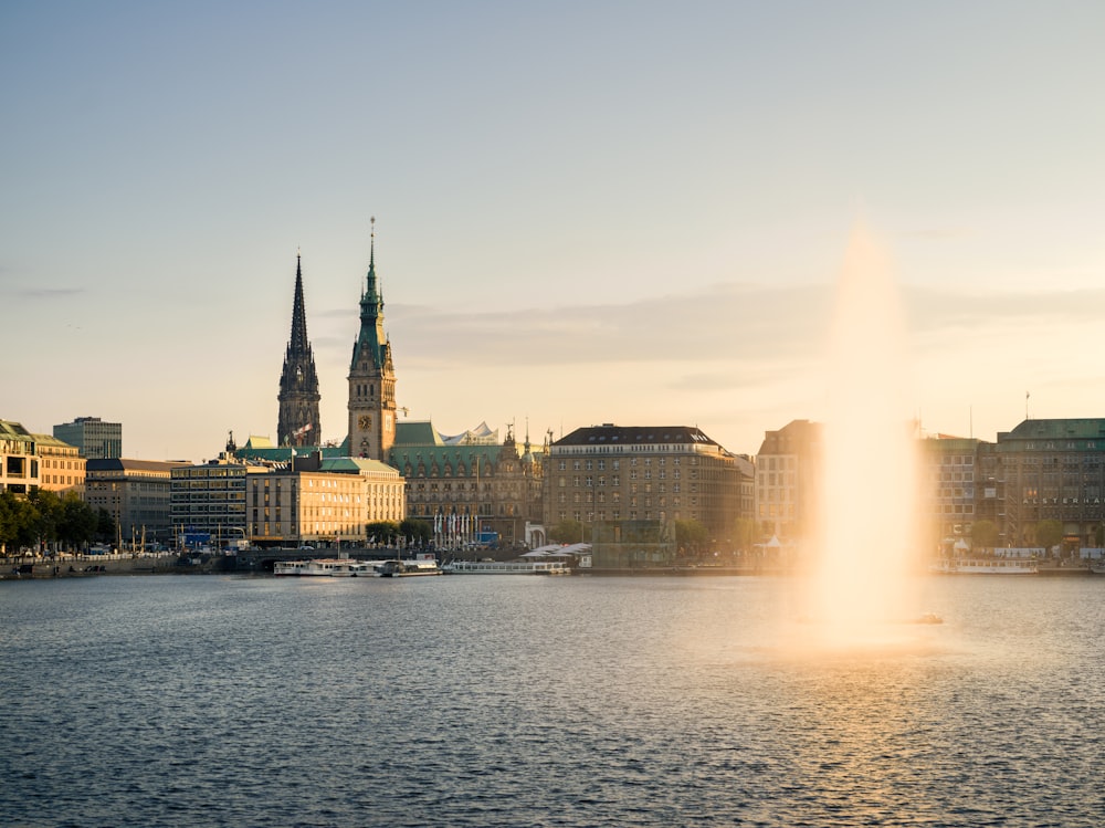 a large body of water with a fountain in the middle of it