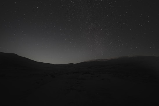 A serene cosmic landscape blending Earth and stars, symbolizing expanded human consciousness.