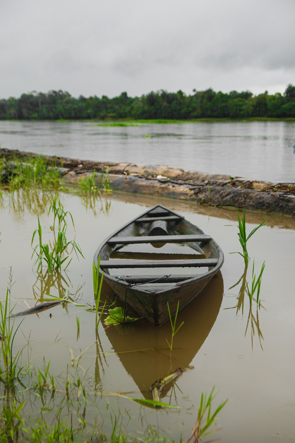 a small boat sitting on top of a body of water