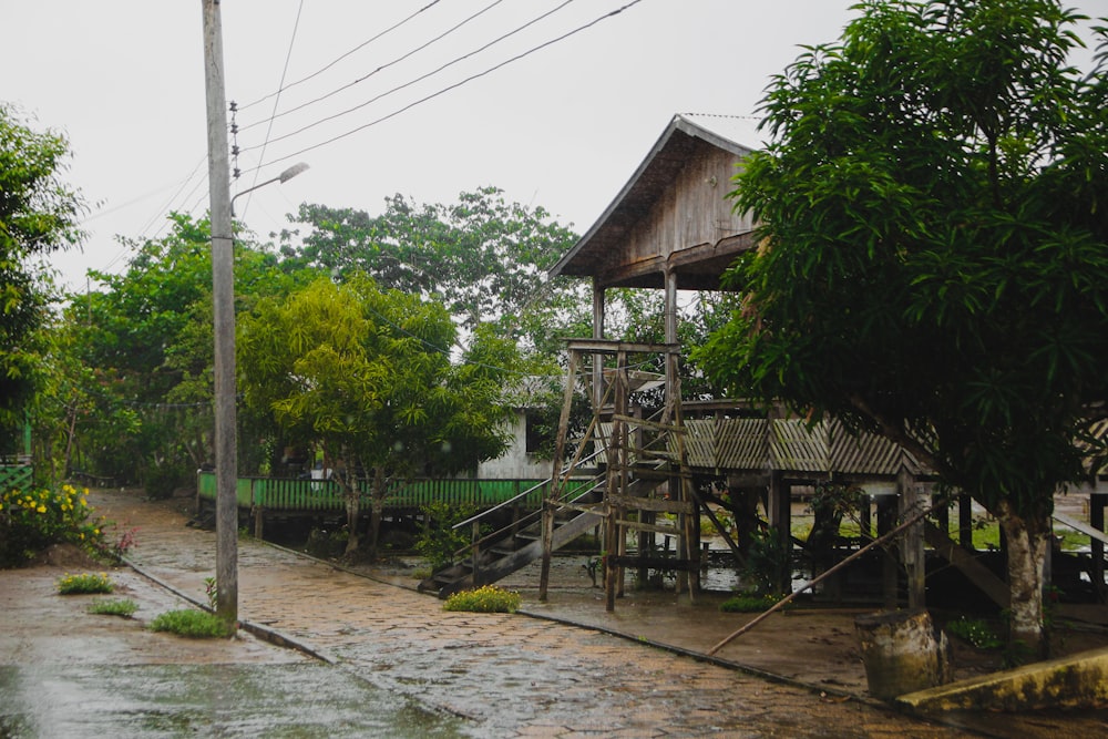 a wooden structure sitting on top of a wet street