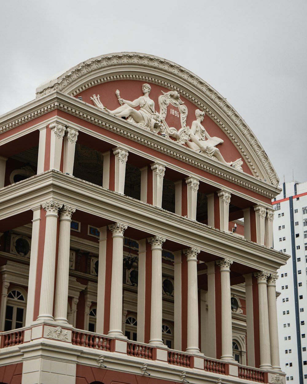 a large building with statues on top of it