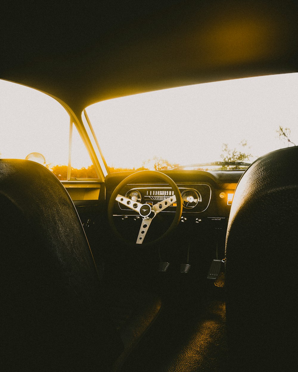 the interior of a car with a steering wheel