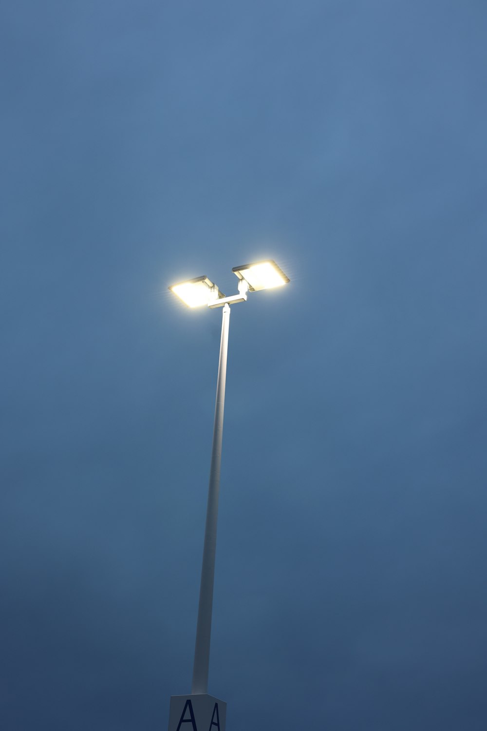 a street light with two lights on top of it