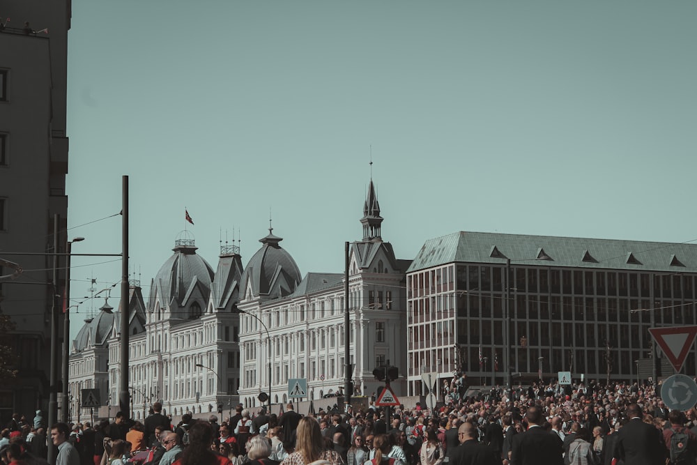 a large group of people standing in front of a building