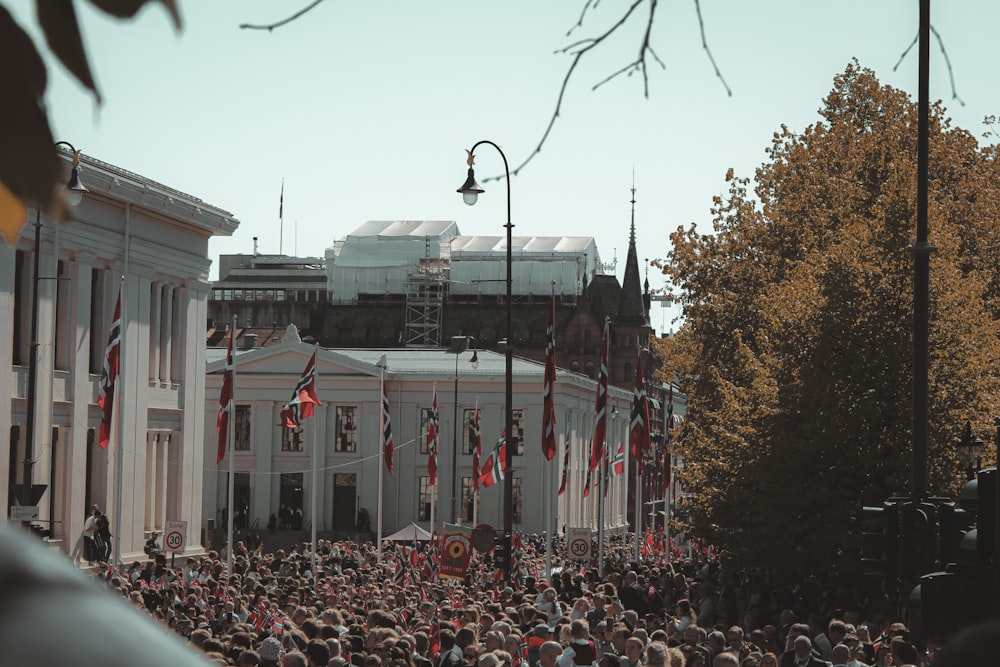 a large crowd of people in front of a building