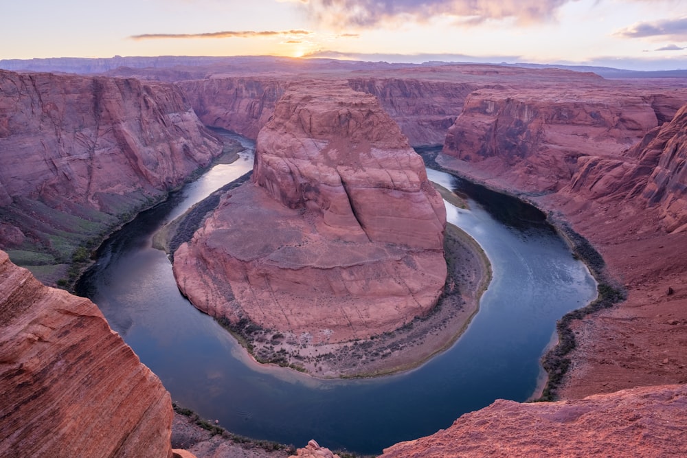 a river running through a canyon surrounded by mountains