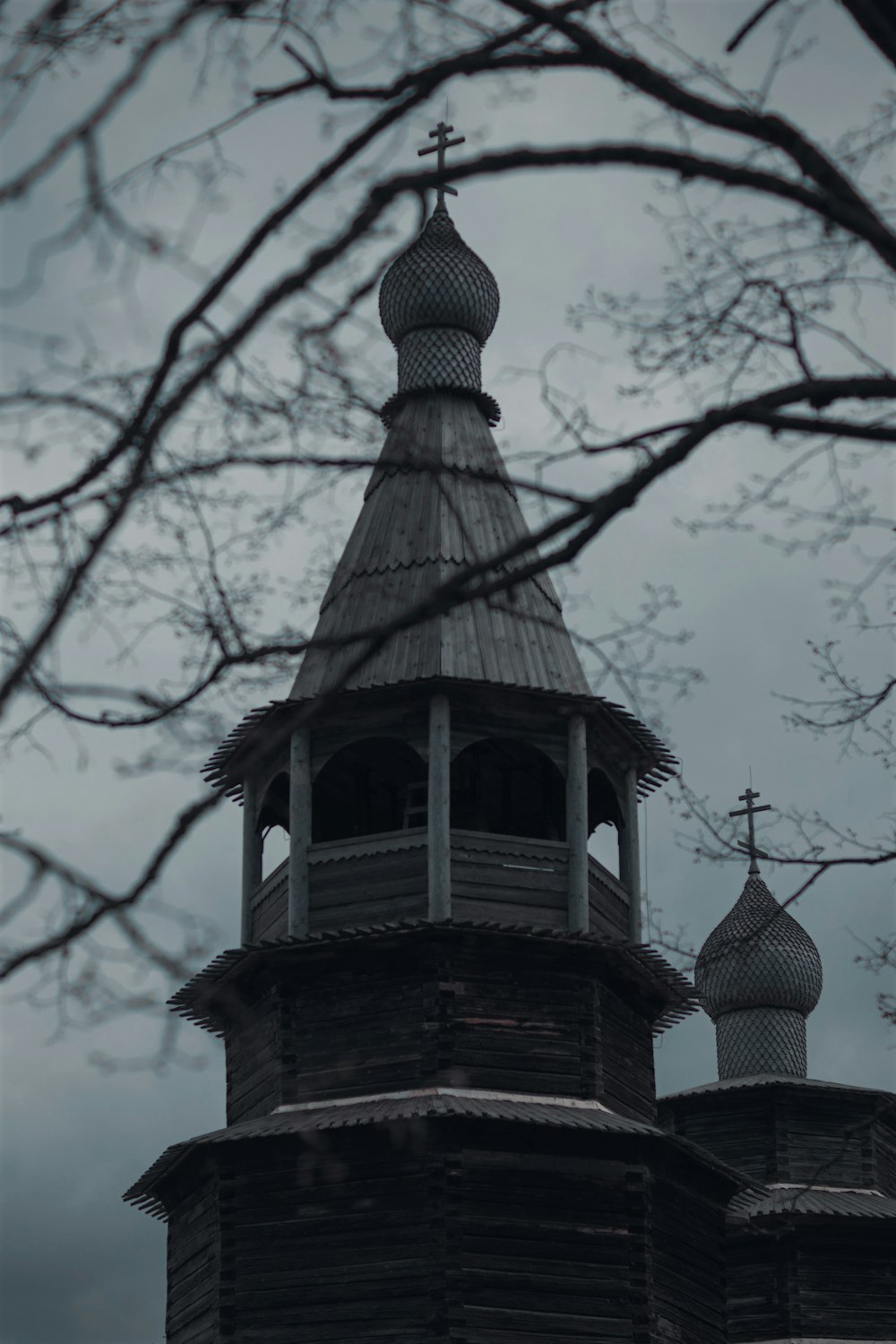 a large tall tower with a clock at the top of a building