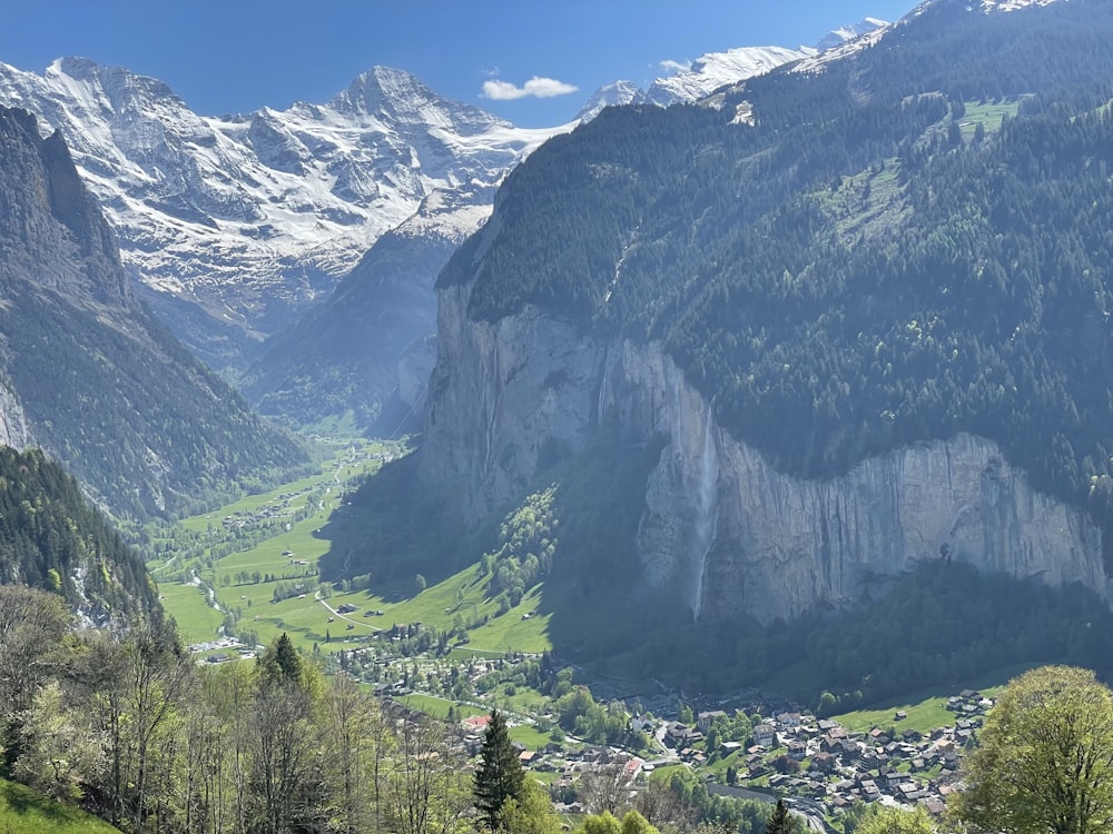 a view of a valley with mountains in the background