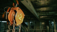 a close up of a chain hoist in a factory
