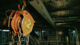 a close up of a chain hoist in a factory