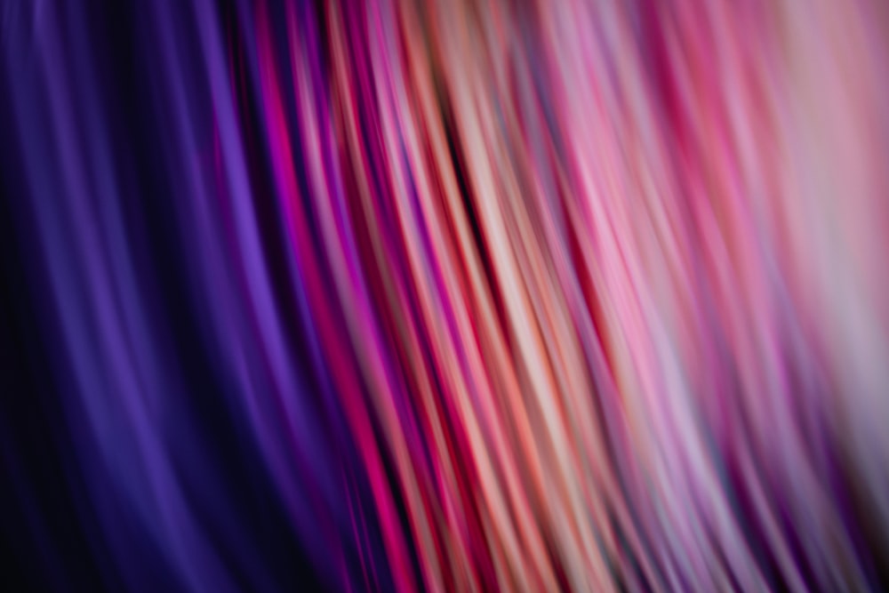 a blurry image of a purple and pink background