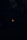 A dark night sky filled with stars surrounds a vivid red moon at the center, evoking a sense of mystery and tranquility. The moon's color suggests a lunar eclipse, creating a striking contrast against the darkness.
