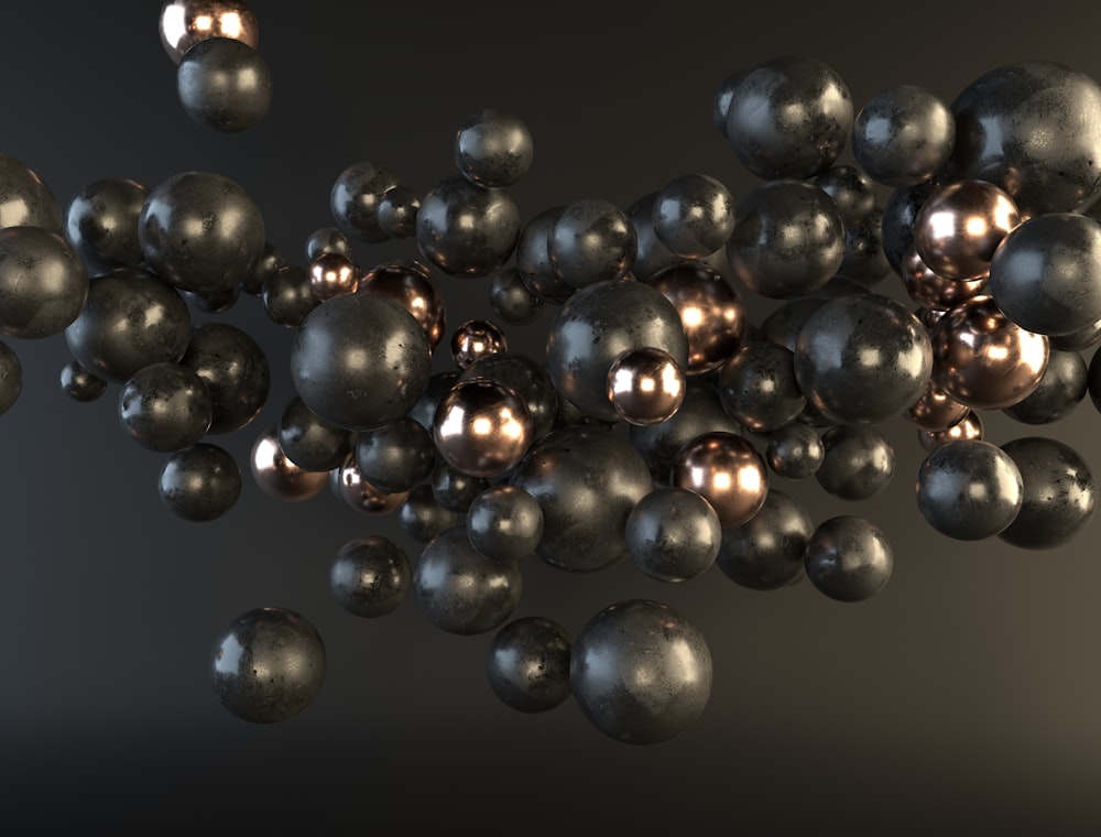 a bunch of metallic balls floating in the air