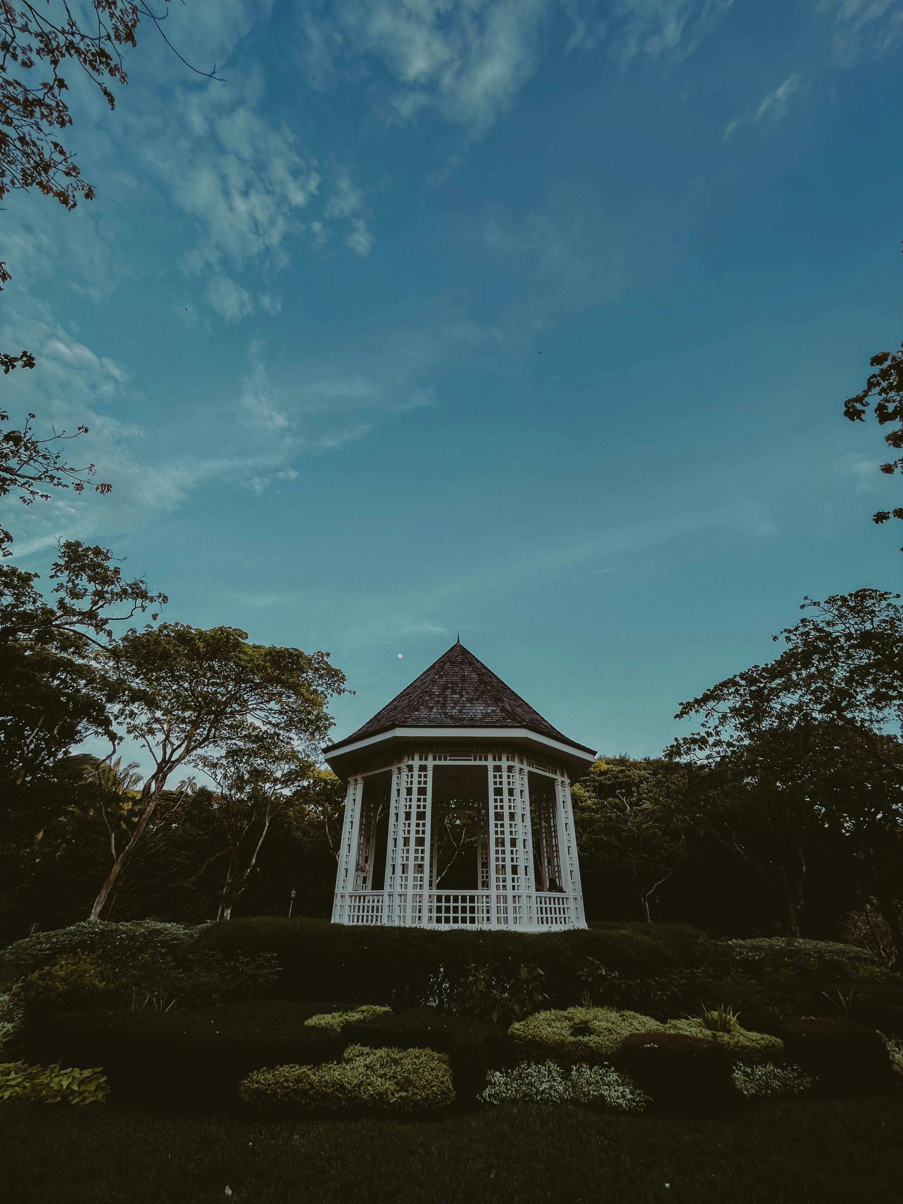 a gazebo in the middle of a garden