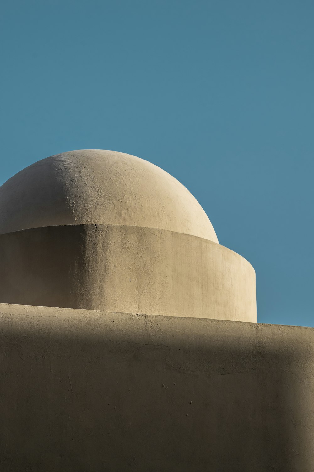 a dome on top of a building against a blue sky