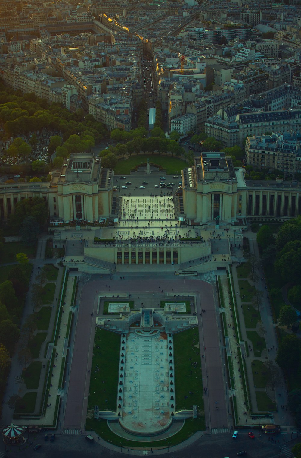 an aerial view of a large building in the middle of a city