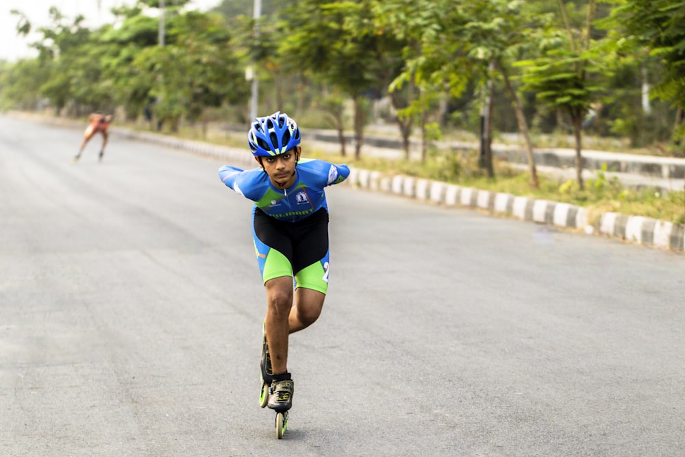 a man riding a skateboard down a street