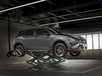 a car on a lift in a garage