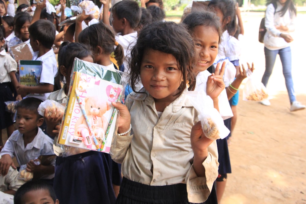 a group of young children standing next to each other