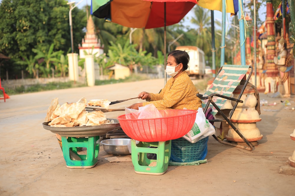 a woman sitting at a table with food on it