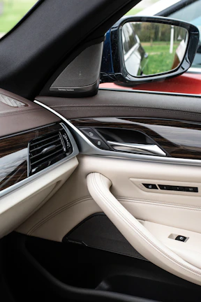 the inside of a car with the door open