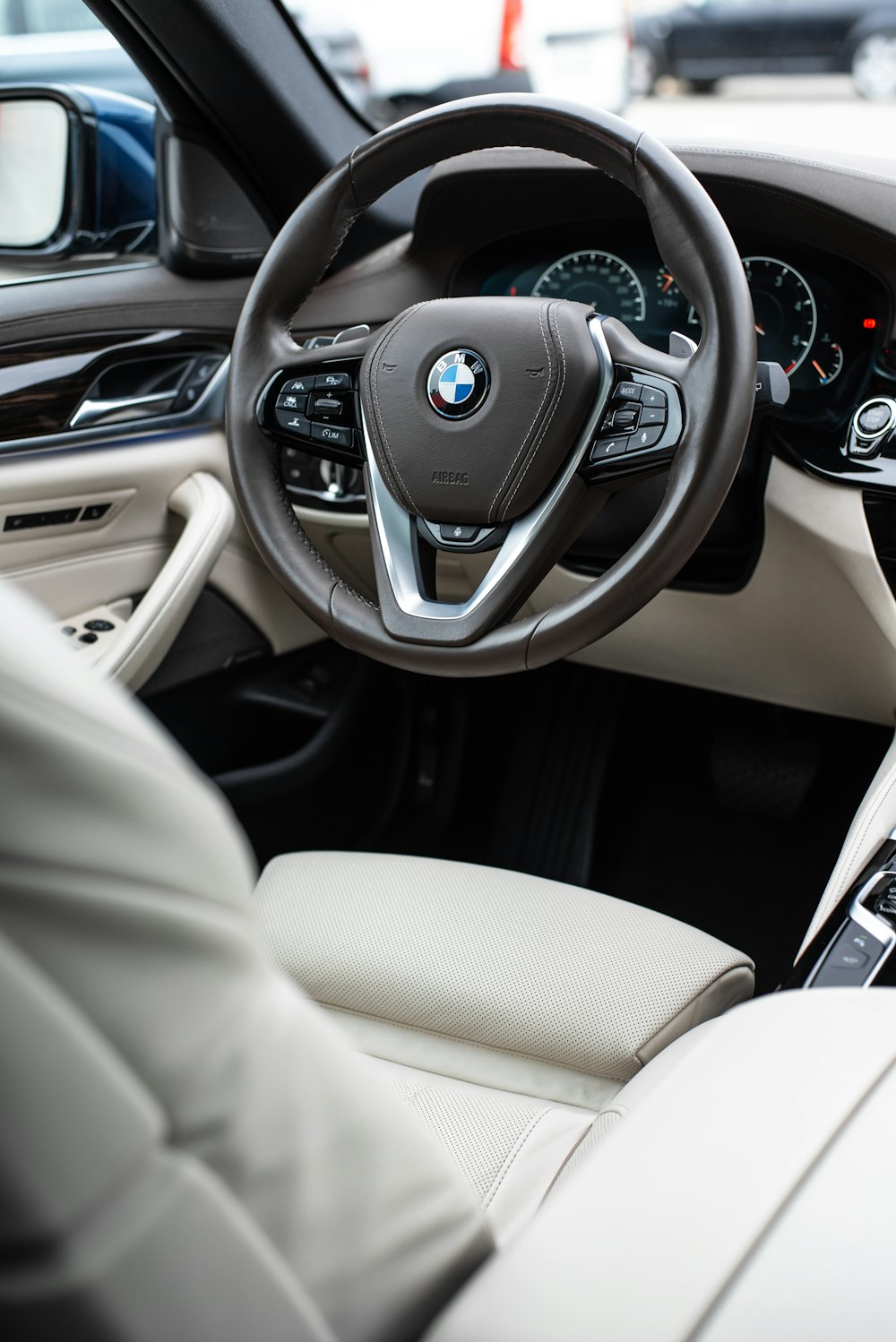 the interior of a car with a steering wheel and dashboard