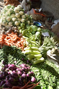 a table filled with lots of different types of vegetables