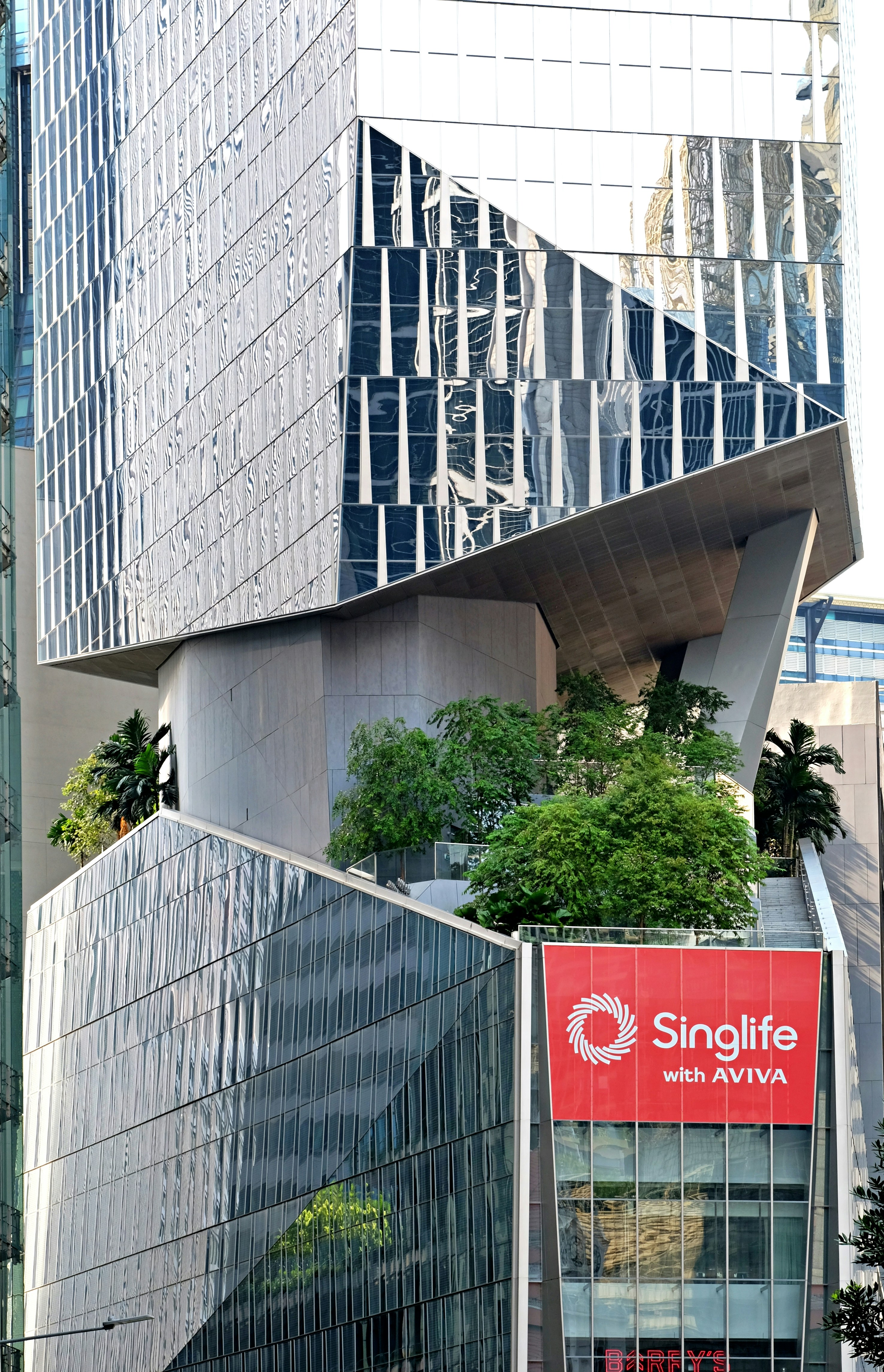 a tall building with a sign on the side of it