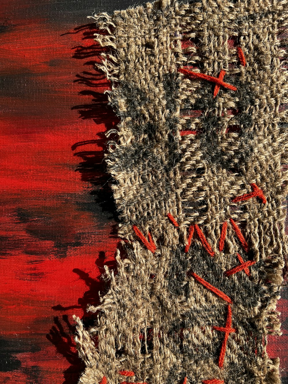a close up of a piece of cloth with a cross on it
