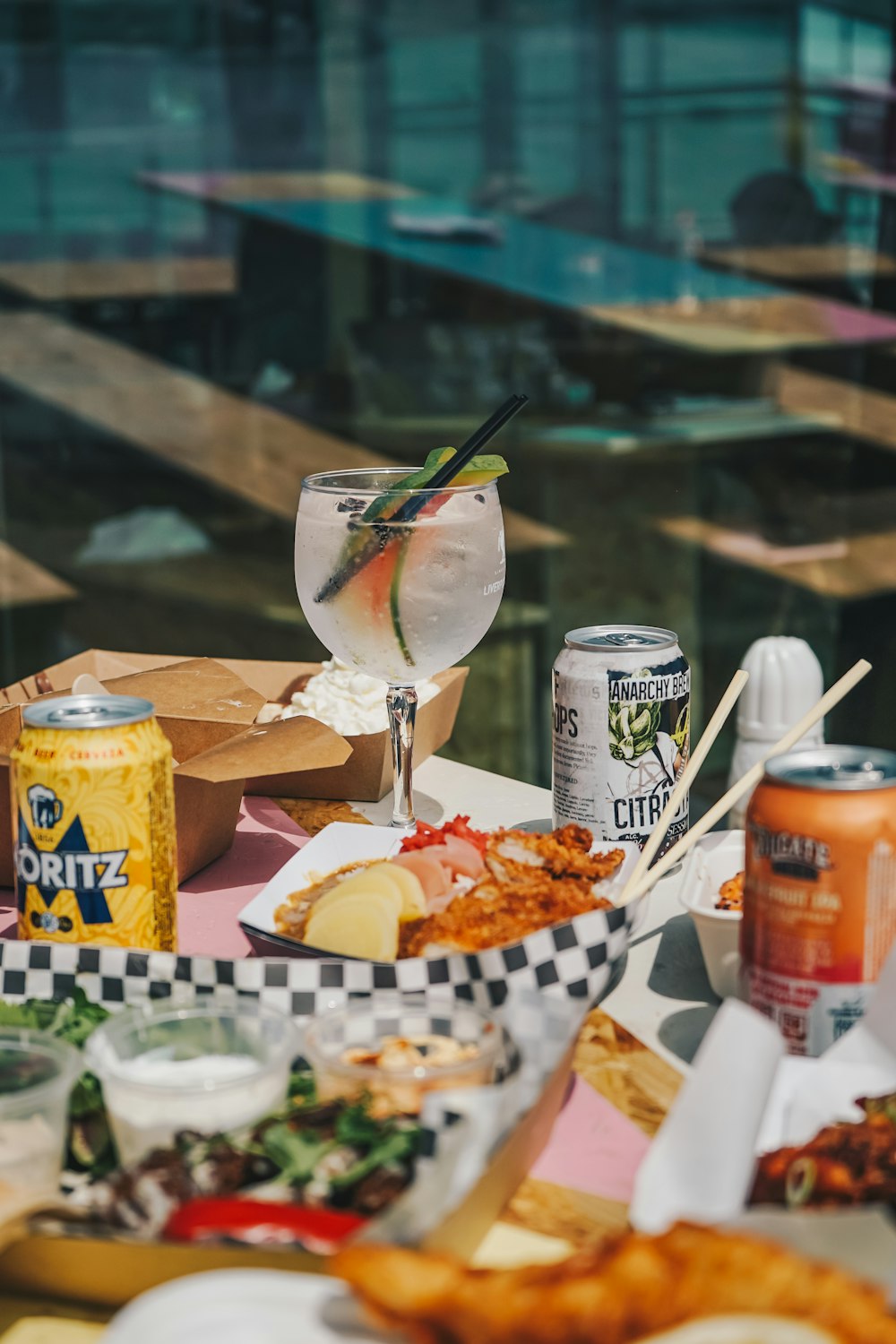 a table topped with lots of food and drinks