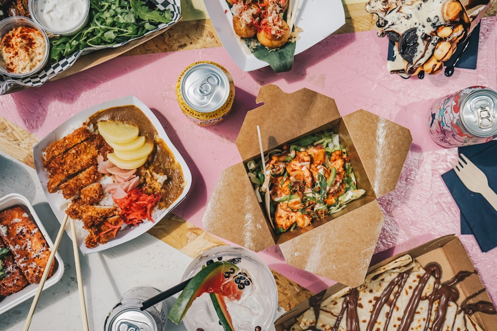 a table topped with lots of food and drinks