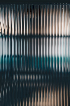 a blurry image of a window with bars on it