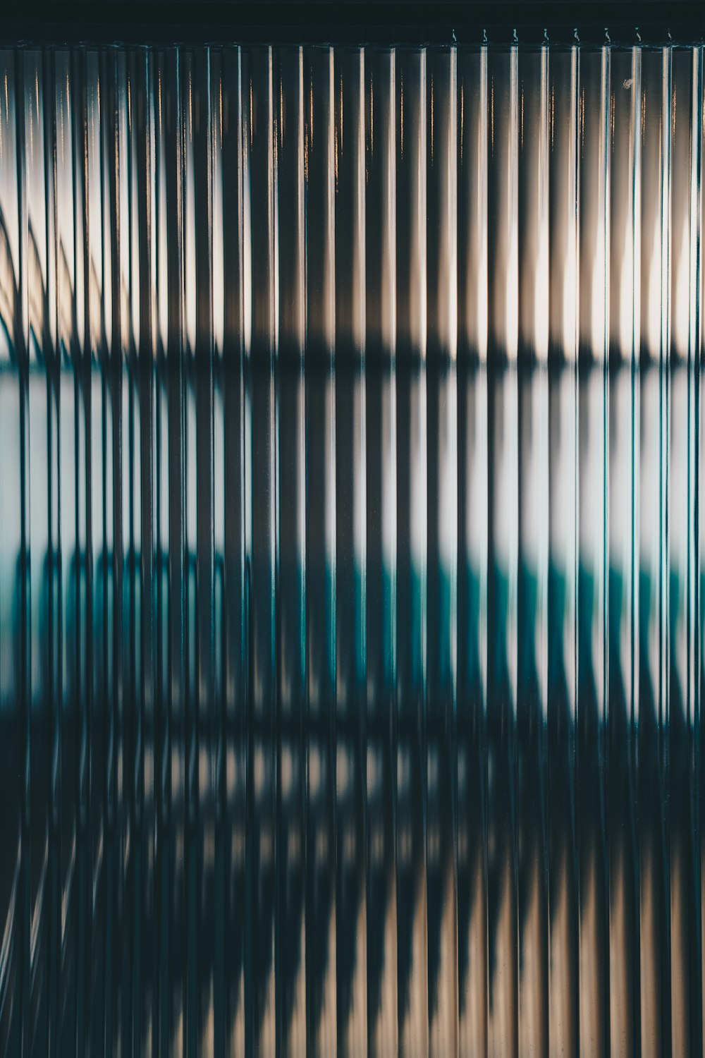 a blurry image of a window with bars on it
