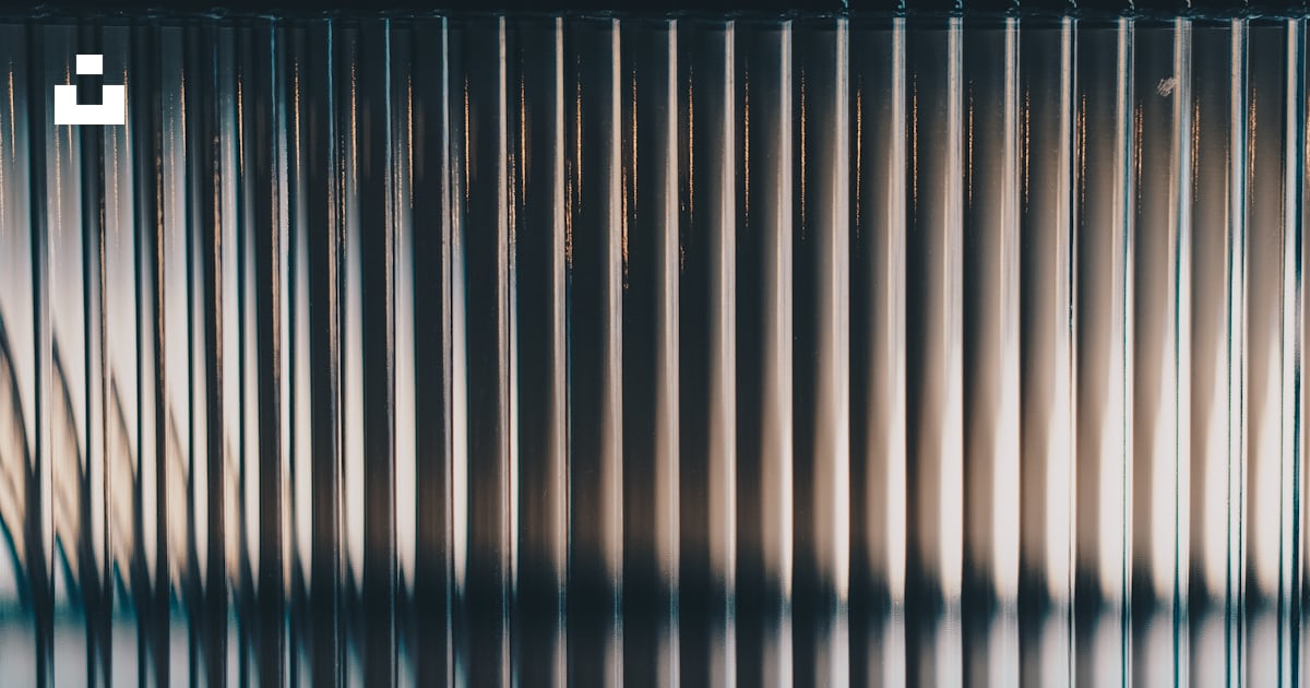 A blurry image of a window with bars on it photo – Free Texture Image ...