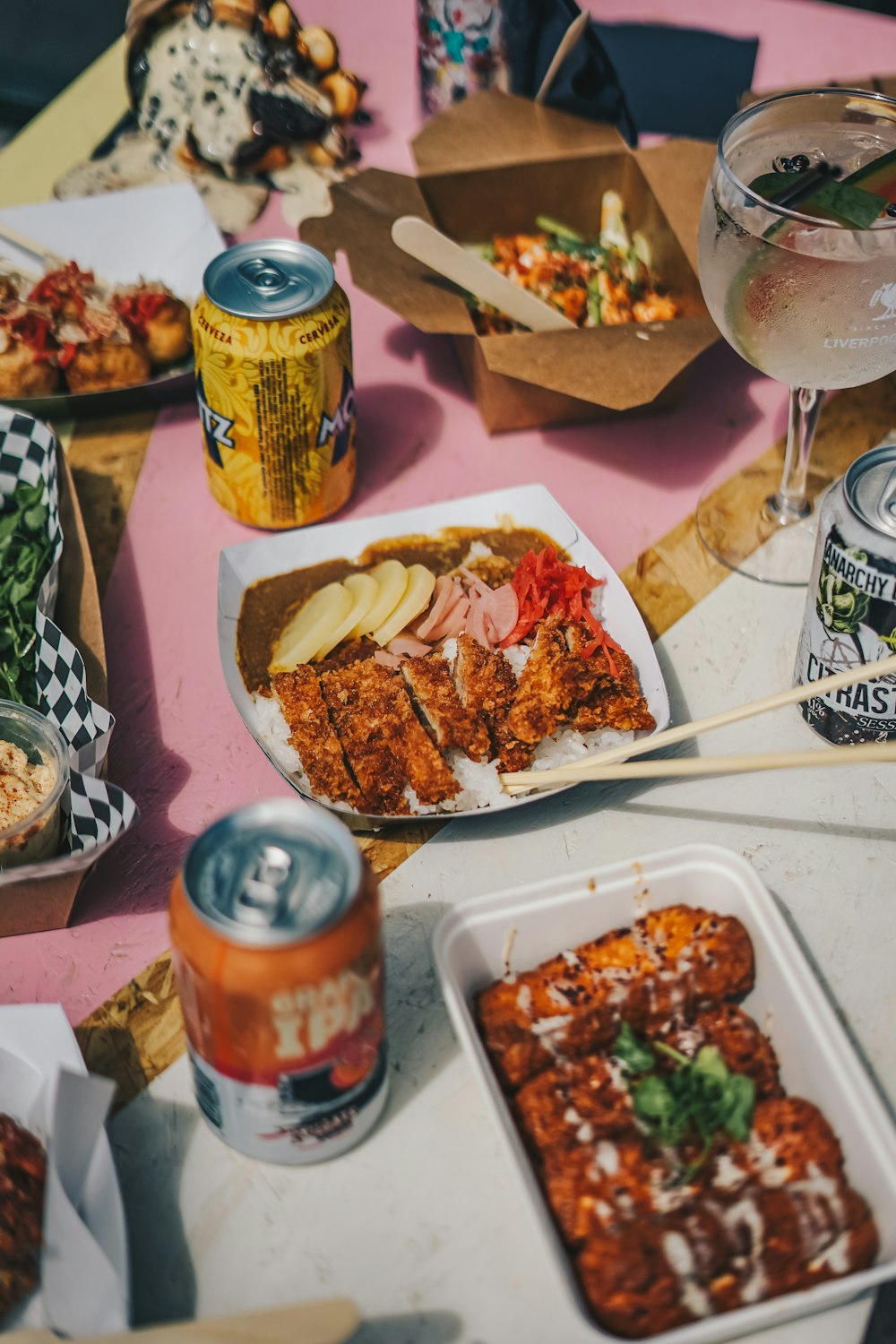 a table topped with lots of food and drinks