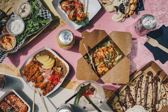 a table filled with lots of food and drinks