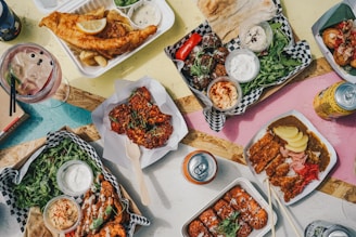 a table topped with plates of food and drinks