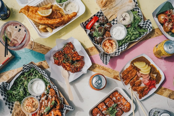 a table topped with plates of food and drinks