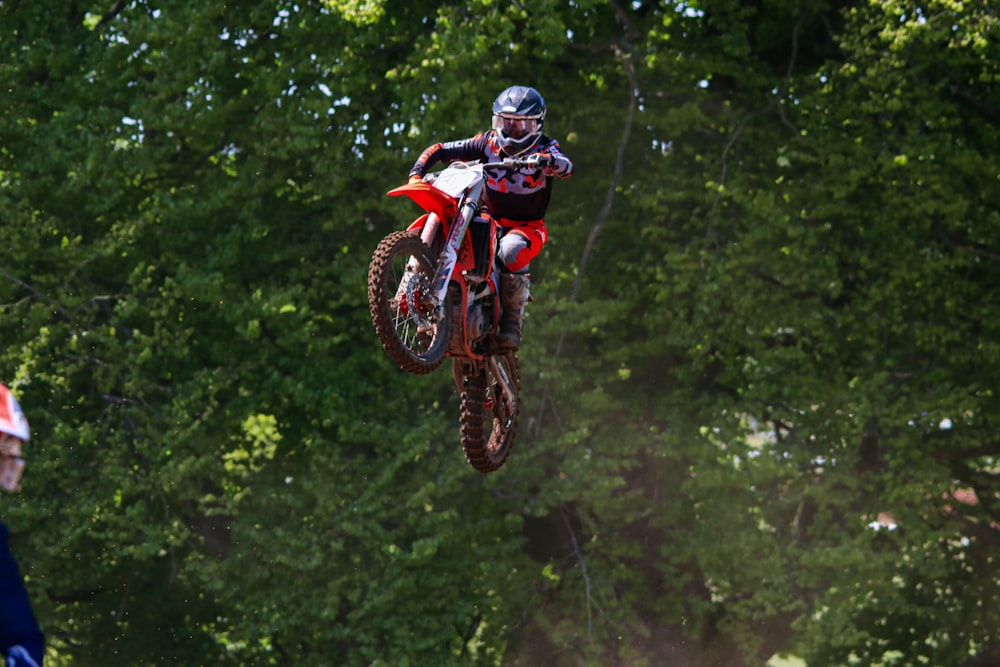 a person on a dirt bike in the air