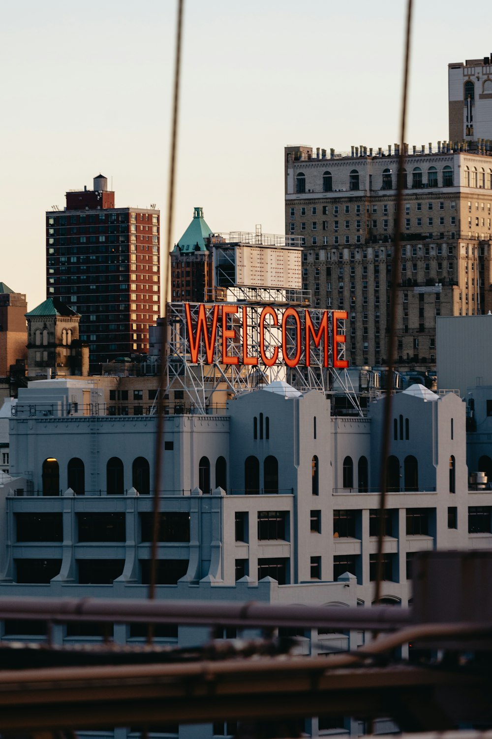 a view of a city with a sign that says welcome