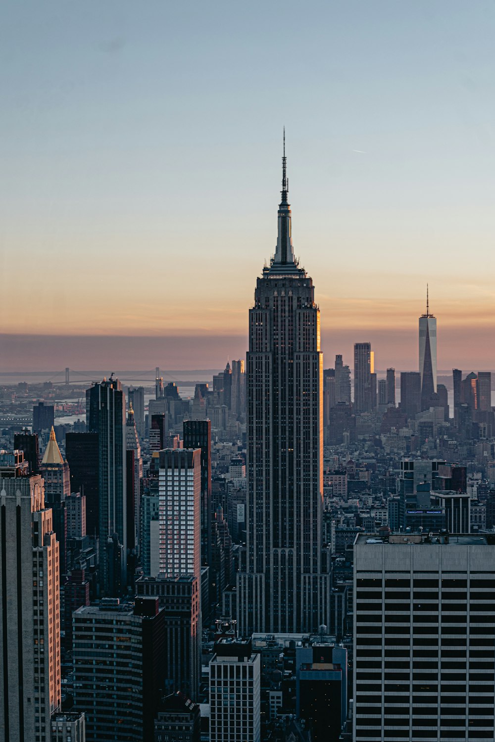 a view of a city skyline at sunset