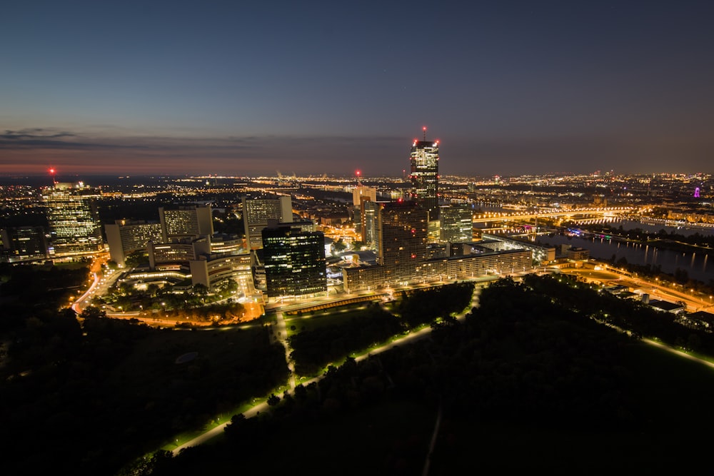 a view of a city at night from the top of a hill