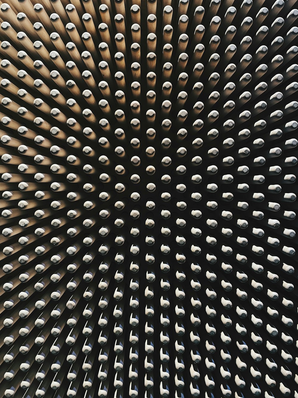 a close up of a metal object with lots of rivets